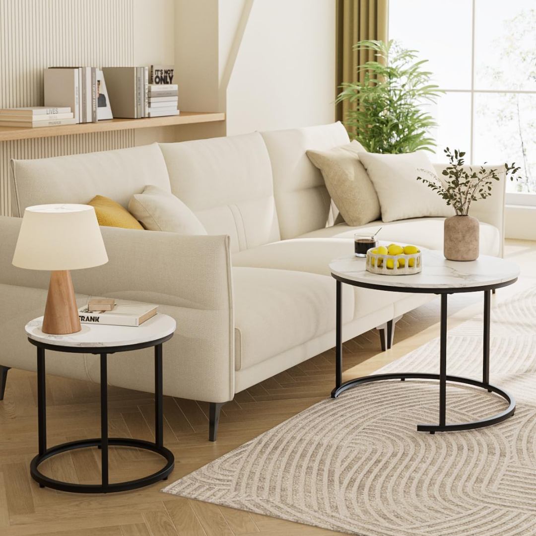 Modern living room with a white sofa, side tables, and decorative items.