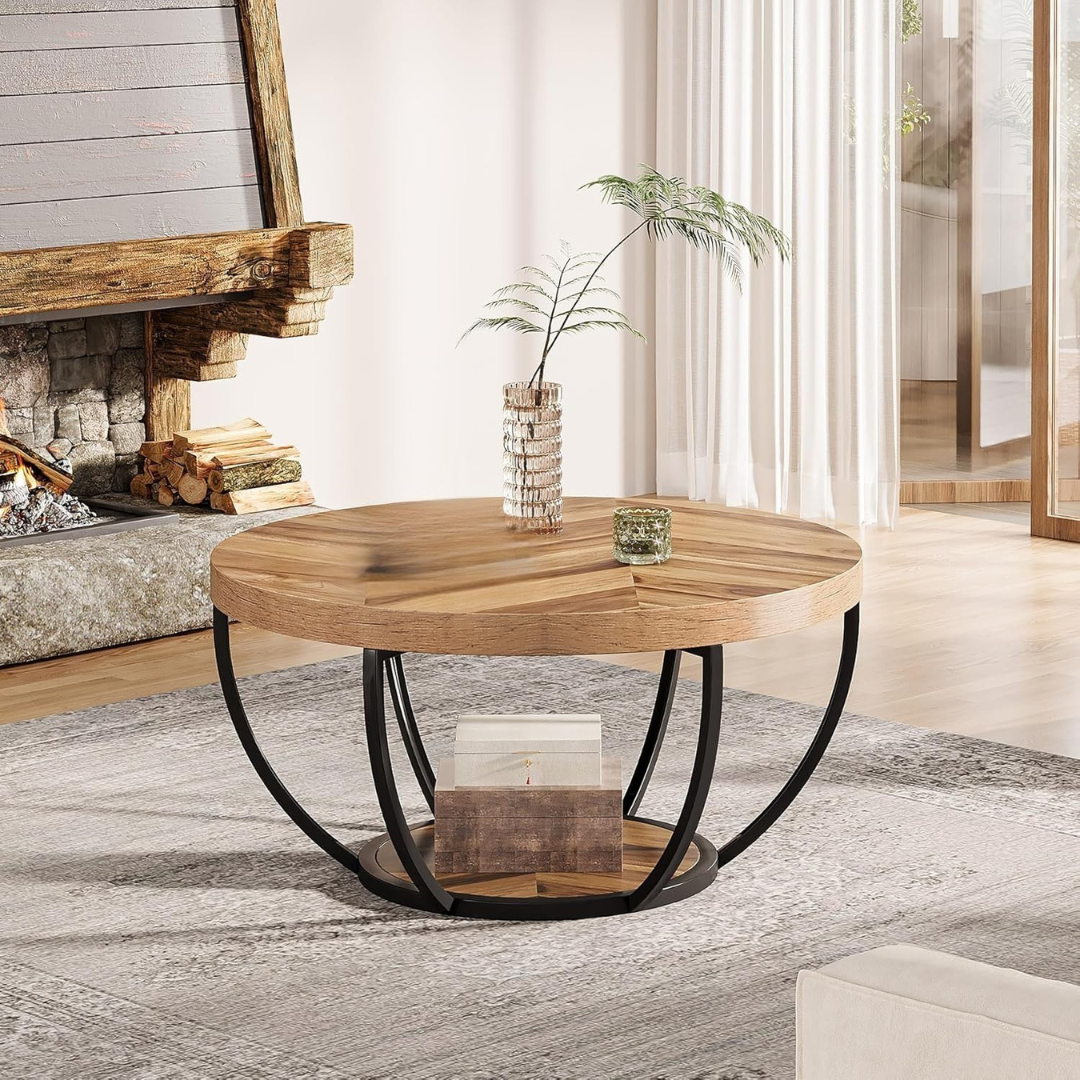 Round wooden rustic coffee table with open black base. set Infront of a fireplace.
