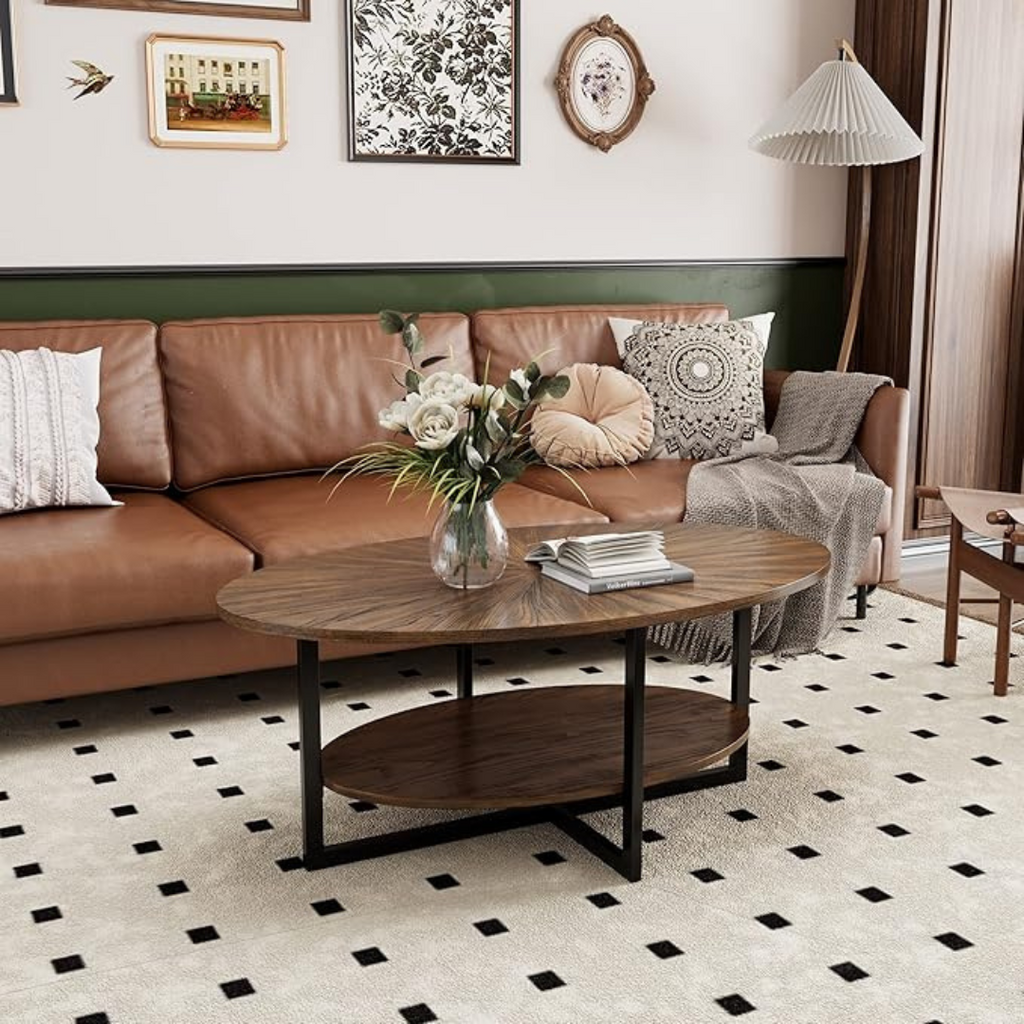 Rustic brown oval coffee table with lower shelf, set up in a rustic home.