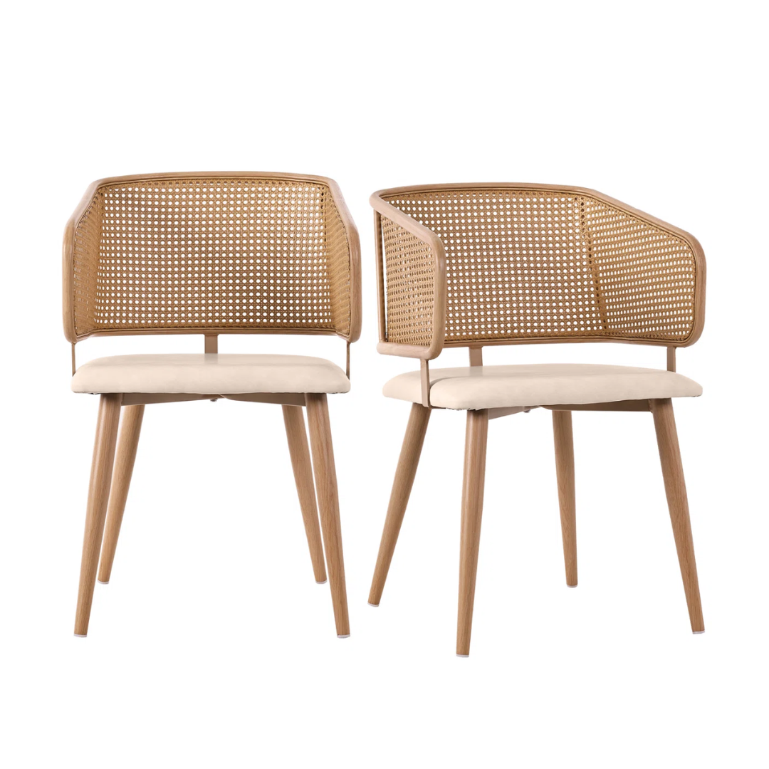 Two wooden chairs with wicker backrests and beige cushions on a white background