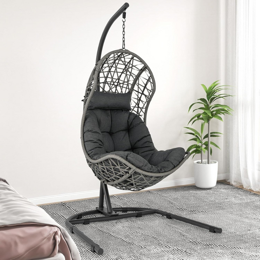 Single Rattan Hanging Egg Chair And Stand, set in a modern home.