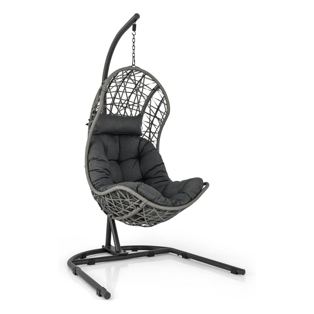 Single Rattan Hanging Egg Chair And Stand, white background.