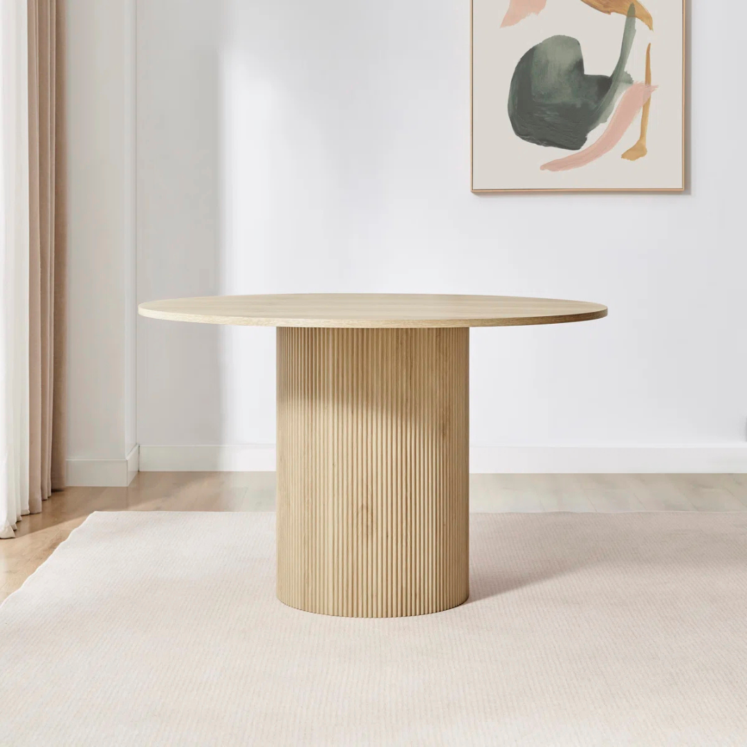 Slatted Round Contemporary Dining Room Table, set in a model room.