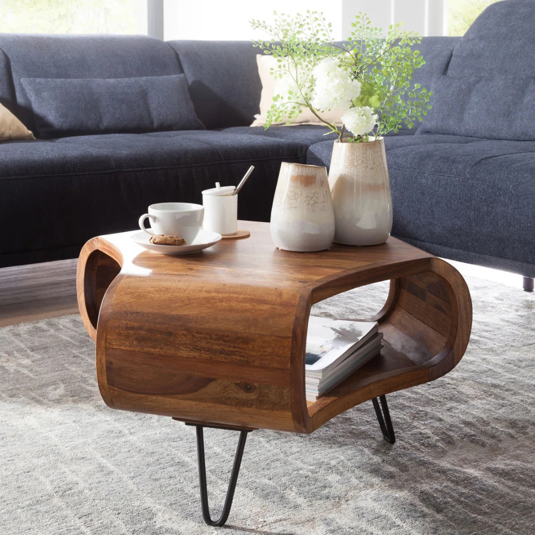 Solid wood quirky coffee table with sculpted shape, set in a modern home, side view.