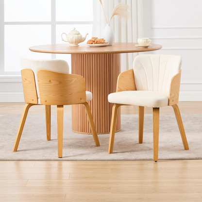 Solid Wood Danish Modern Dining Chair styled in a modern dining room with a stylish table