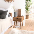Solid Wooden Bedside Table, set in a model home.