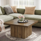 Wooden coffee table with a vase of flowers in a living room setting