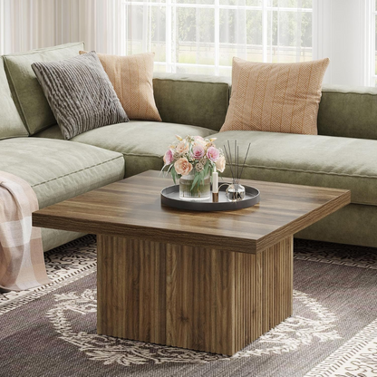 Wooden coffee table with a vase of flowers in a living room setting