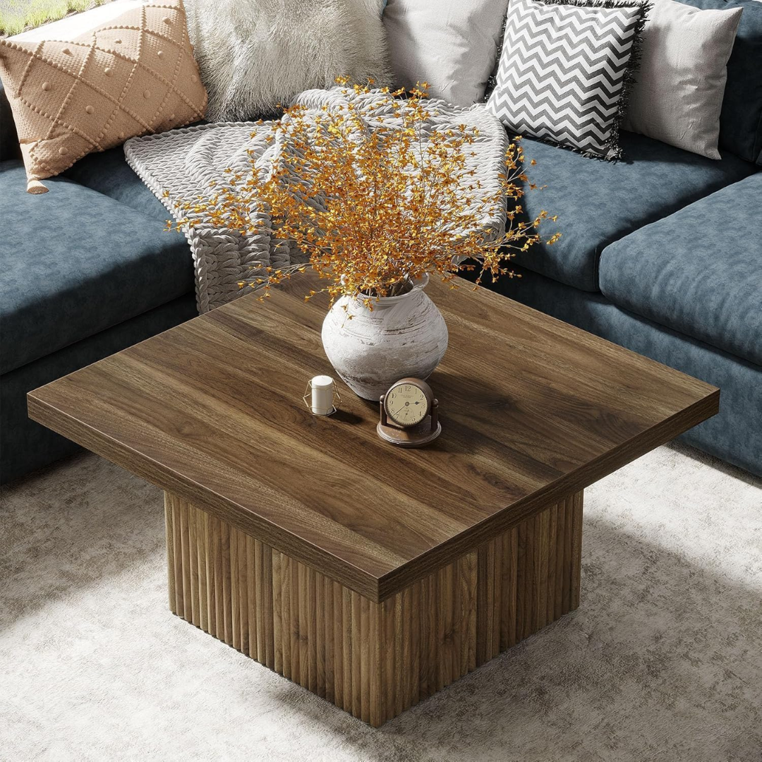 Wooden coffee table with decorative items in a living room setting