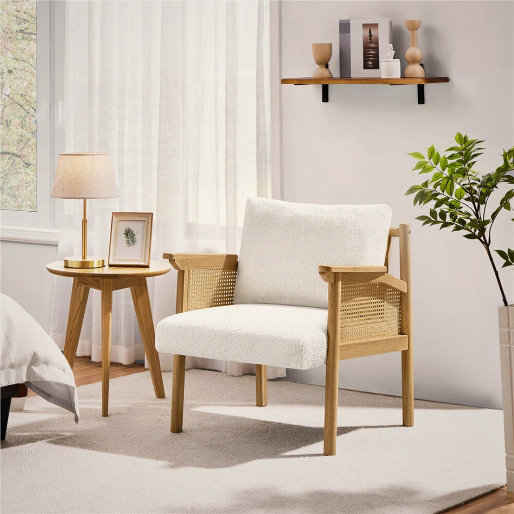 upholstered indoor rattan armchair with wood frame, styled in a modern bedroom.
