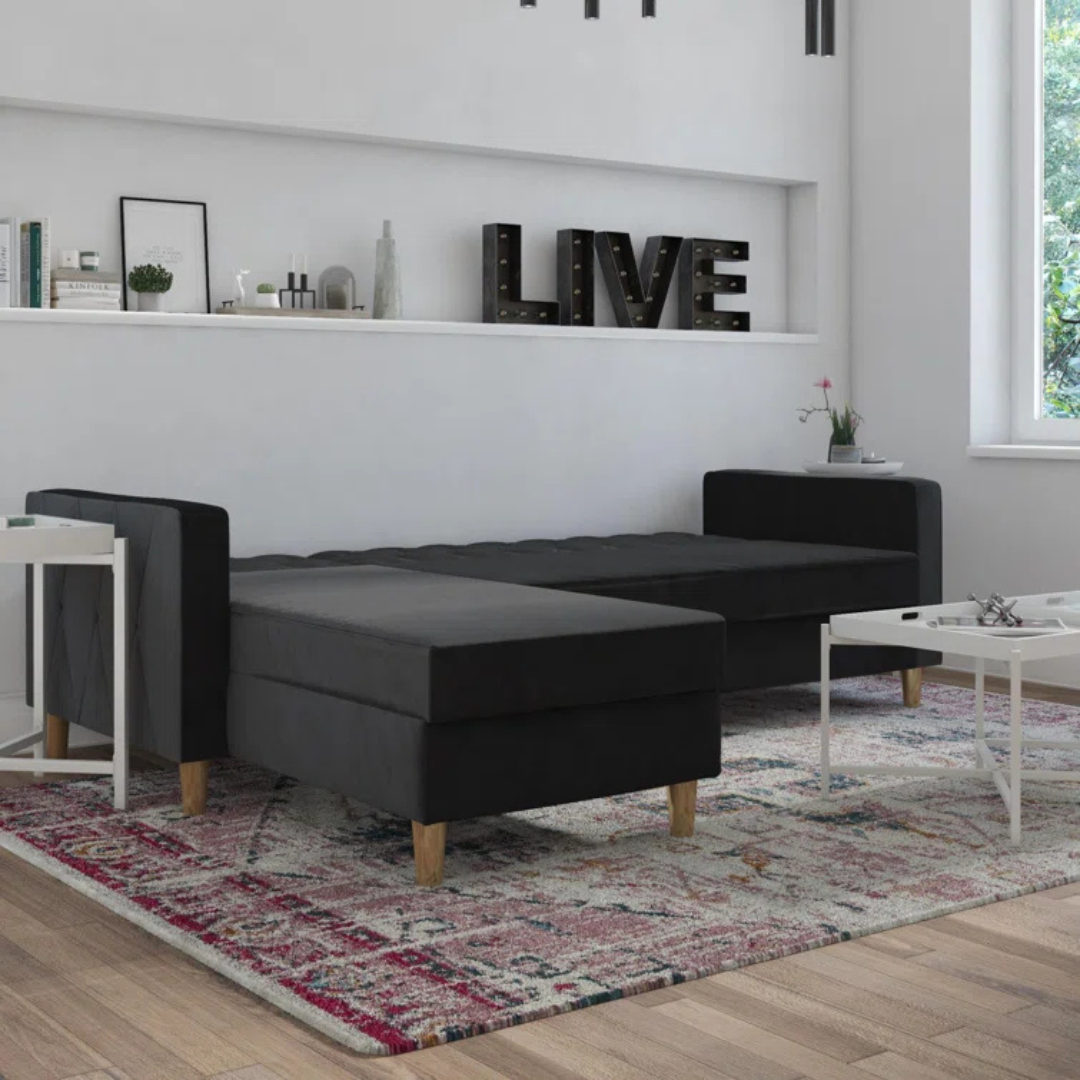 Velvet Black L Shape Sofa Bed With Storage, set in a modern home, showing it laid out in bed form.