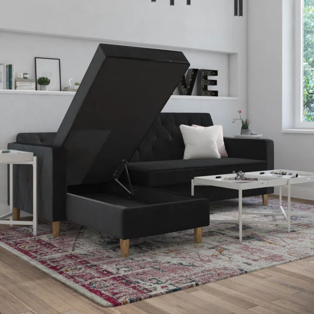Velvet Black L Shape Sofa Bed With Storage, set in a modern home, showing the under sofa storage.