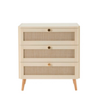 Beige chest of drawers with woven front panels on a white background
