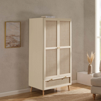 Beige wardrobe with glass panels in a room with a painting and vase on a shelf.