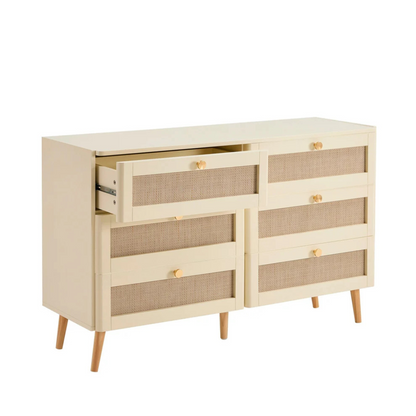 Beige dresser with wicker drawers on a white background