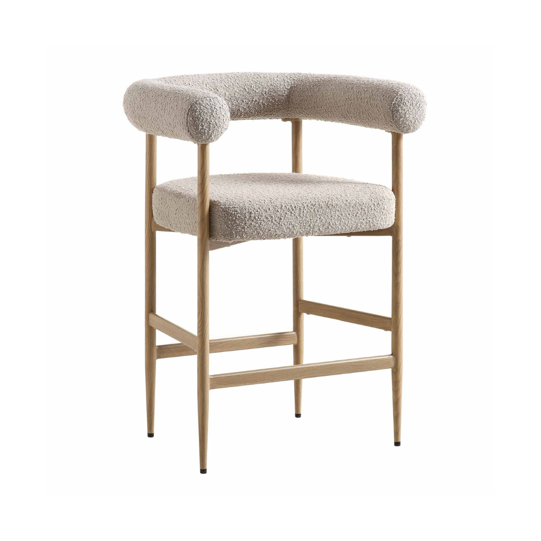 Bar stool with beige cushioned seat and backrest on a white background