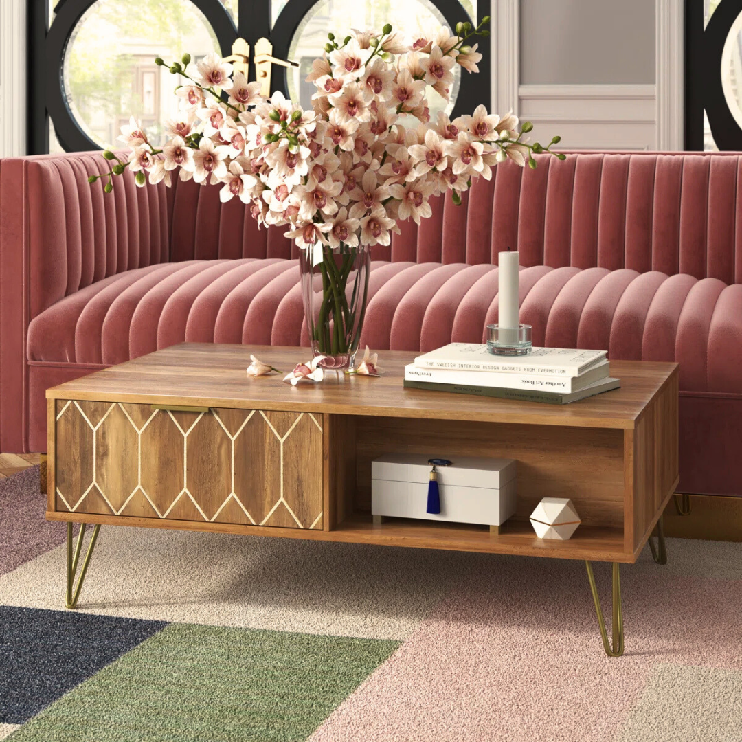 Wooden art deco coffee table with gold accents, set in a mid century living space.