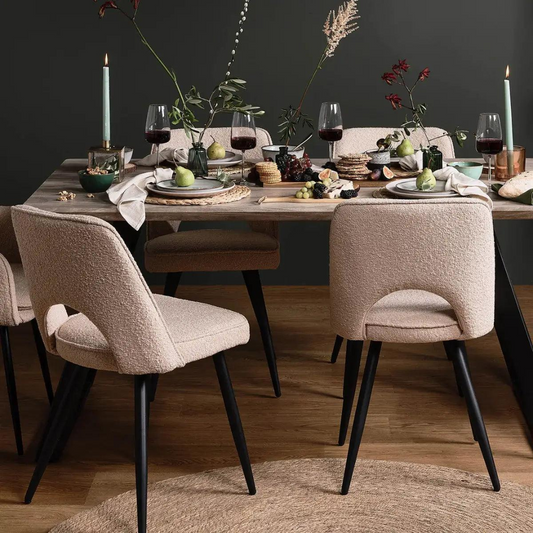 Beige Boucle Dining Room Chairs styled on a wood modern dining table 