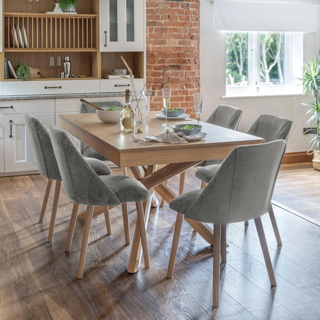 Velvet Grey Dining Chairs Wood Legs - Set Of Two styled in a modern dining room set up